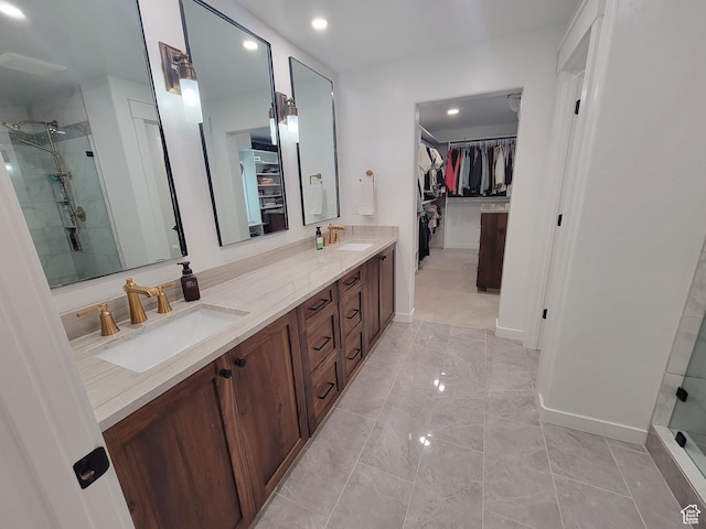 298 E 400 S, Orem, UT 84058 - full bath featuring a spacious closet, a stall shower, double vanity, marble look tile flooring, and recessed lighting