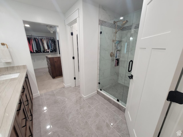 298 E 400 S, Orem, UT 84058 - full bathroom with a stall shower, vanity, a spacious closet, and marble finish flooring
