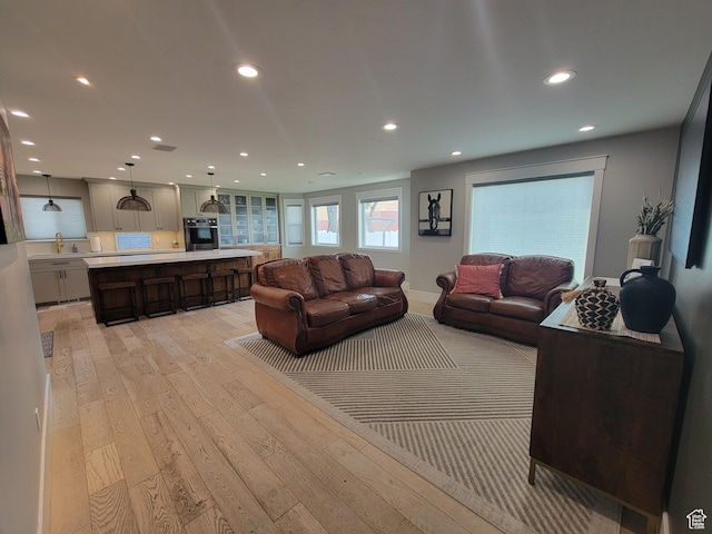 298 E 400 S, Orem, UT 84058 - living room featuring light wood-type flooring and recessed lighting