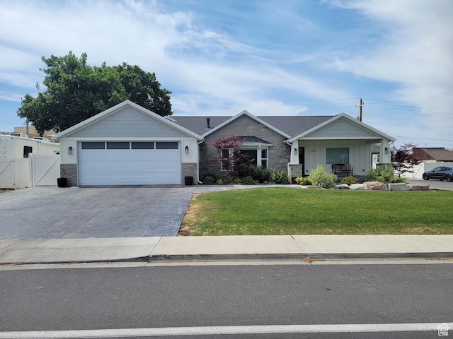 298 E 400 S, Orem, UT 84058 - view of front facade featuring asphalt driveway, a gate, an attached garage, and stone siding