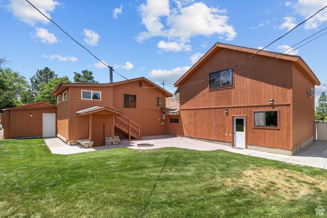 294 W 200 N, Mount Pleasant, UT 84647 - rear view of property featuring a patio area, an outbuilding, a lawn, stairs, and an outdoor fire pit