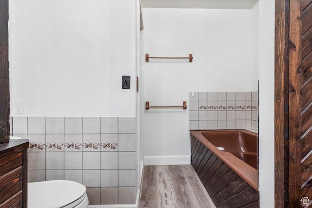 294 W 200 N, Mount Pleasant, UT 84647 - full bathroom featuring tile walls, a bath, wood finished floors, and vanity