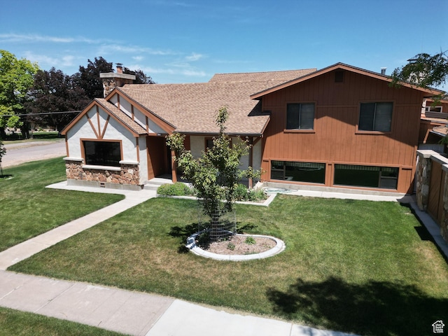 294 W 200 N, Mount Pleasant, UT 84647 - view of front of house featuring a front yard, a chimney, and stone siding