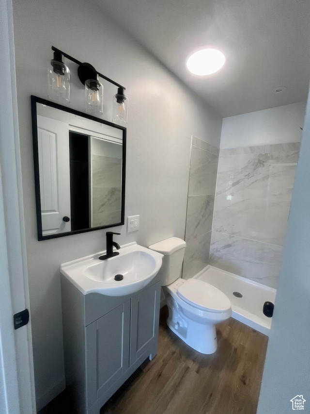 599 N State St, Mayfield, UT 84643 - bathroom featuring wood finished floors, vanity, and a tile shower