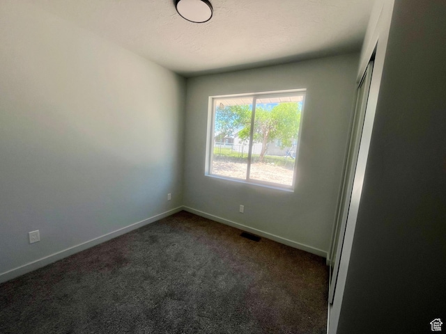 599 N State St, Mayfield, UT 84643 - spare room featuring dark colored carpet and baseboards