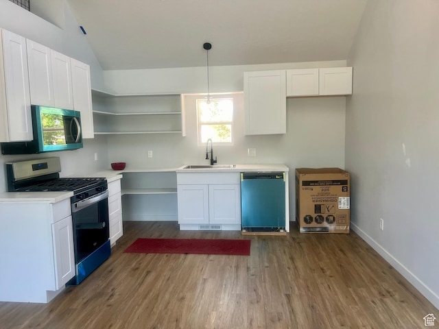 599 N State St, Mayfield, UT 84643 - kitchen with appliances with stainless steel finishes, vaulted ceiling, white cabinetry, wood finished floors, and open shelves