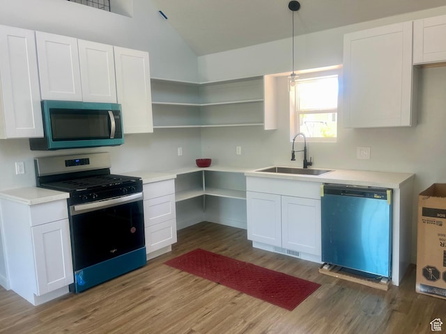599 N State St, Mayfield, UT 84643 - kitchen with stainless steel range with gas cooktop, dishwasher, light wood finished floors, white cabinets, and vaulted ceiling