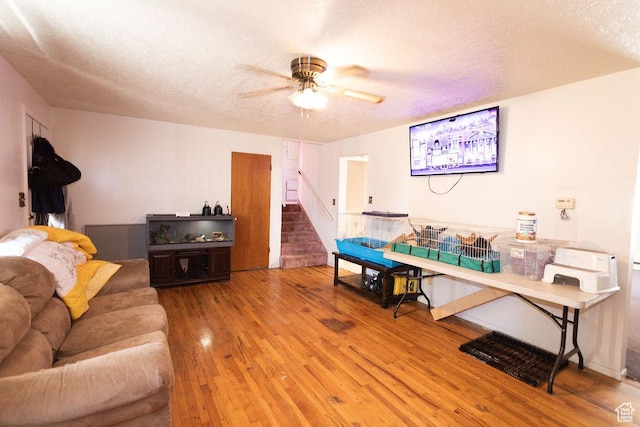 960 N 100 W, Tremonton, UT 84337 - living room with hardwood / wood-style floors, stairs, ceiling fan, and a textured ceiling