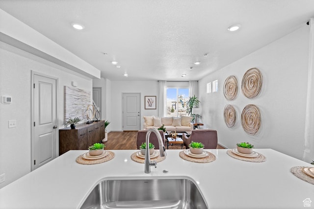 201 E 400 S Unit 982, Saratoga Springs, UT 84045 - kitchen featuring light countertops, wood finished floors, recessed lighting, and open floor plan