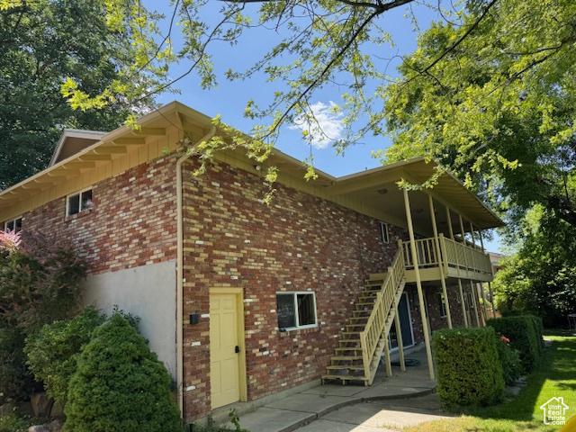 2727 N 700 E, Provo, UT 84604 - back of house with brick siding, stairs, and a patio