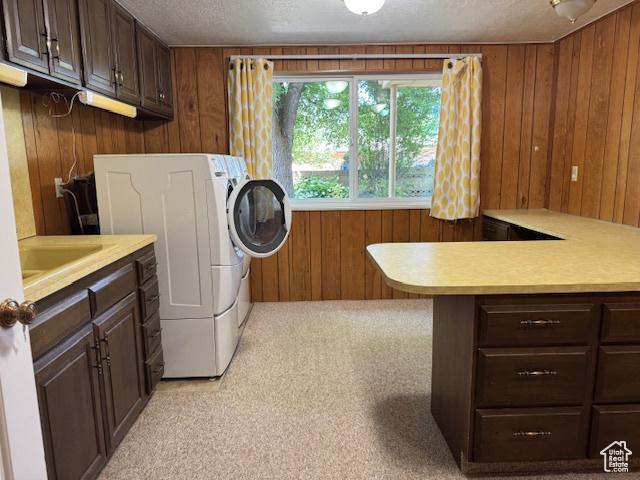 2727 N 700 E, Provo, UT 84604 - laundry area featuring separate washer and dryer, wooden walls, cabinet space, and a textured ceiling