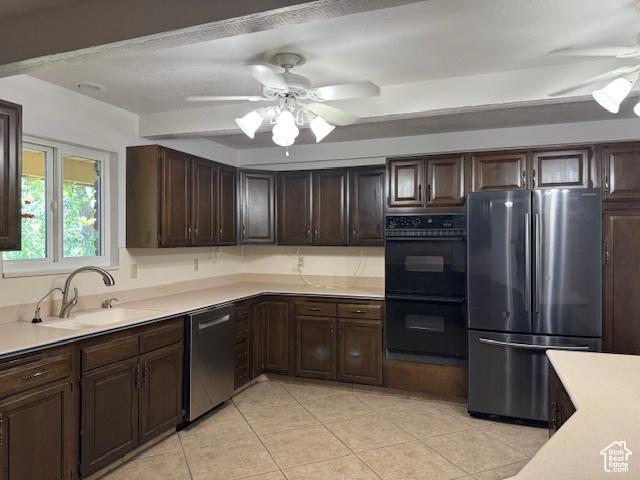 2727 N 700 E, Provo, UT 84604 - kitchen with stainless steel appliances, a ceiling fan, light countertops, and light tile patterned flooring