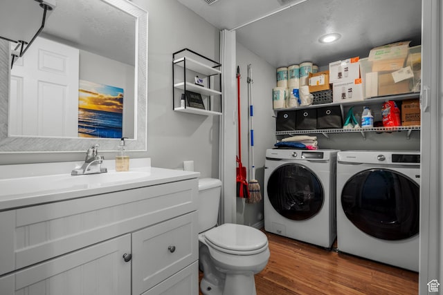 70 E 135 N, Orem, UT 84057 - laundry room with separate washer and dryer, wood finished floors, and recessed lighting