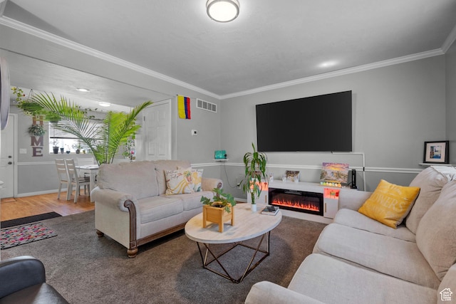 70 E 135 N, Orem, UT 84057 - living room featuring crown molding, a glass covered fireplace, and wood finished floors
