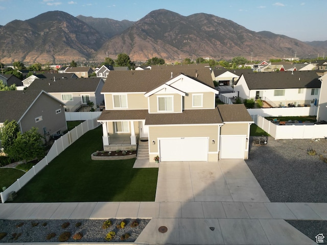 1637 S 730 W, Provo, UT 84601 - view of front of property with a residential view, concrete driveway, a fenced backyard, and a mountain view
