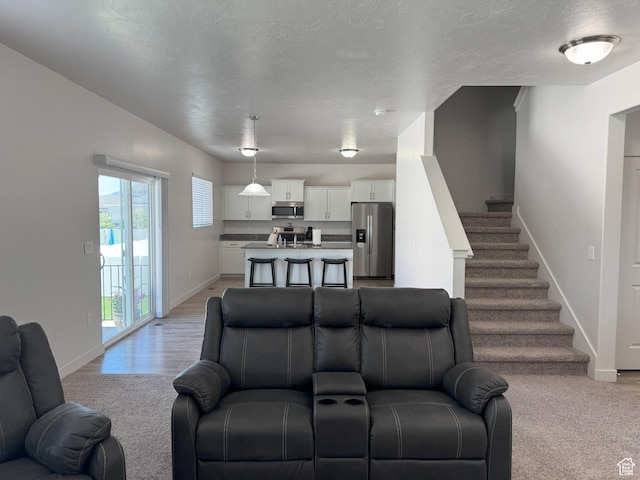 1637 S 730 W, Provo, UT 84601 - living room featuring baseboards and stairway
