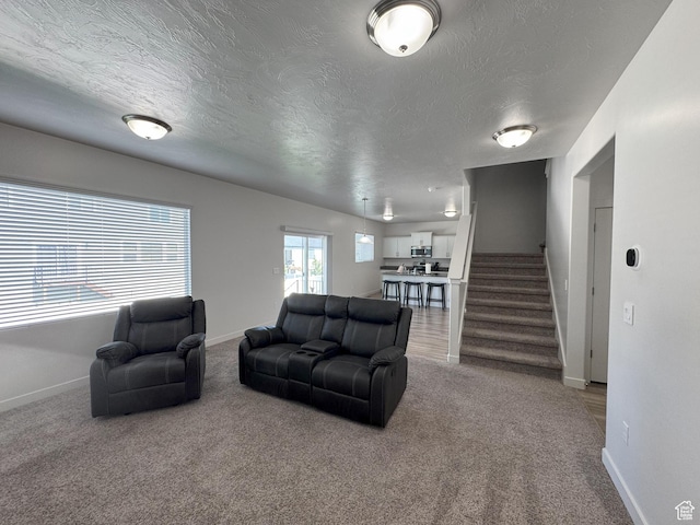 1637 S 730 W, Provo, UT 84601 - carpeted living area featuring a textured ceiling and stairway