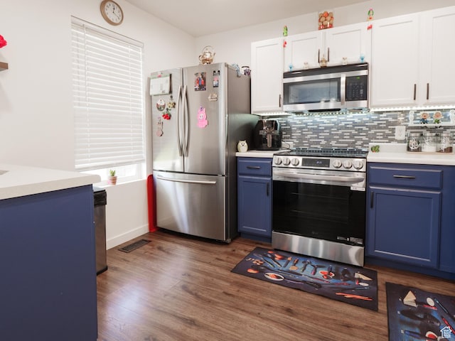 1193 W Dun Robin Ct, Murray, UT 84123 - kitchen with appliances with stainless steel finishes, blue cabinets, light countertops, and dark wood-style flooring
