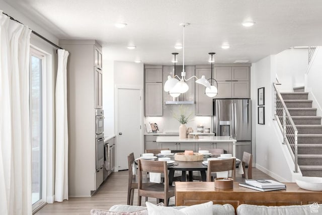 8072 S 300 E Unit 246, Midvale, UT 84070 - dining room featuring light wood-style flooring, stairway, and recessed lighting