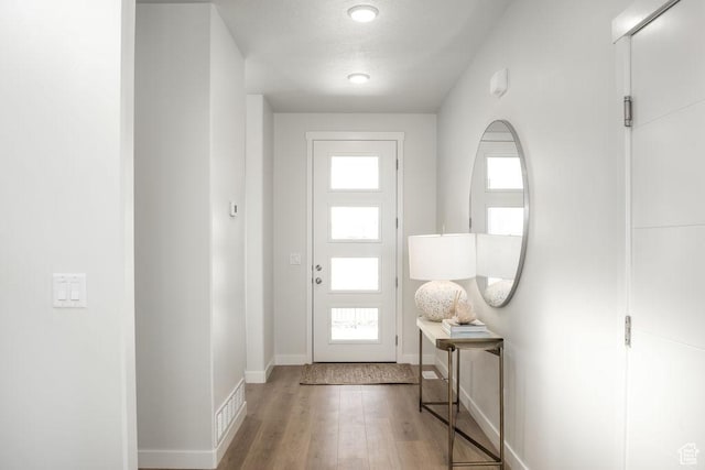 8072 S 300 E Unit 246, Midvale, UT 84070 - entrance foyer with wood finished floors and baseboards