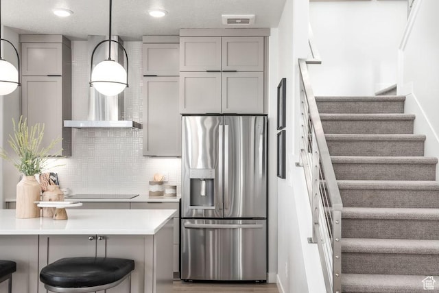 8072 S 300 E Unit 246, Midvale, UT 84070 - kitchen with stainless steel fridge with ice dispenser, gray cabinets, black electric stovetop, light countertops, and decorative backsplash
