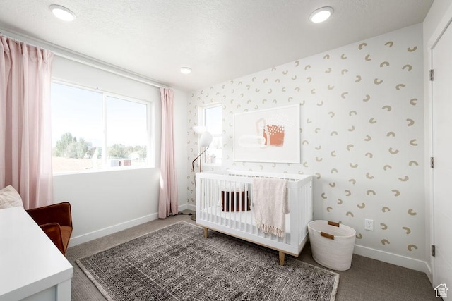 8072 S 300 E Unit 246, Midvale, UT 84070 - bedroom featuring carpet, wallpapered walls, a crib, and recessed lighting