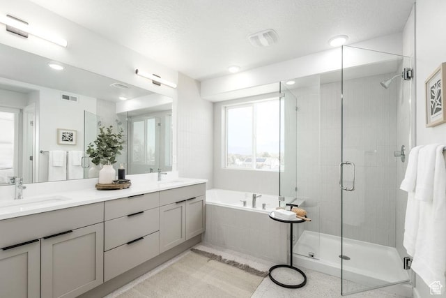 8072 S 300 E Unit 246, Midvale, UT 84070 - bathroom with a garden tub, a stall shower, double vanity, and recessed lighting