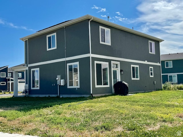 1038 W 980 S Unit 312, American Fork, UT 84003 - rear view of property featuring a yard