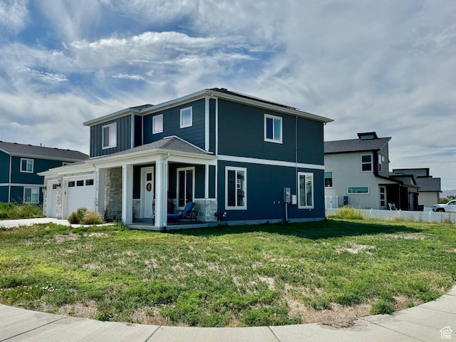 1038 W 980 S Unit 312, American Fork, UT 84003 - traditional-style house with a front yard, covered porch, and an attached garage