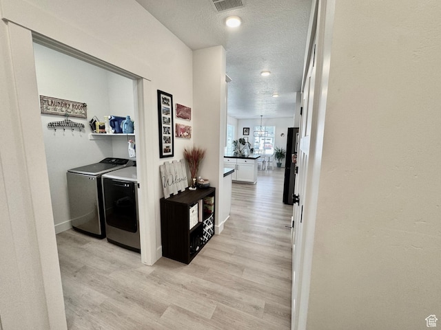 1038 W 980 S Unit 312, American Fork, UT 84003 - corridor with washing machine and dryer, light wood-style floors, a textured ceiling, and recessed lighting