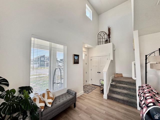 1038 W 980 S Unit 312, American Fork, UT 84003 - foyer entrance featuring light wood finished floors, stairway, and a towering ceiling