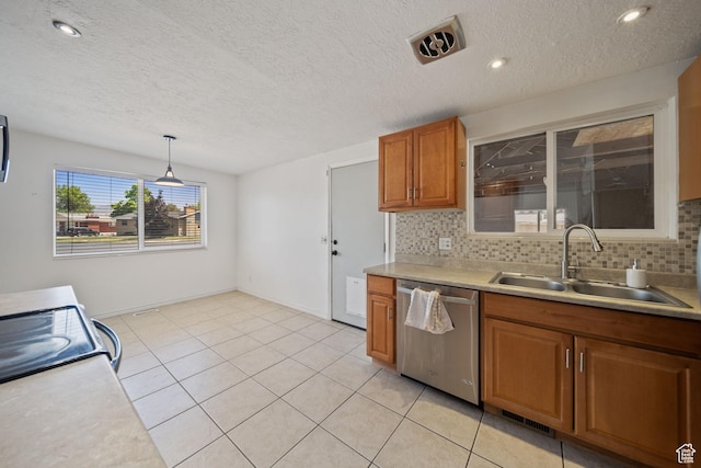 5154 S Lori Way, Salt Lake City, UT 84117 - kitchen with dishwasher, brown cabinets, light countertops, tasteful backsplash, and hanging light fixtures