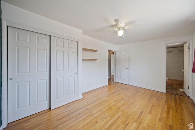5154 S Lori Way, Salt Lake City, UT 84117 - unfurnished bedroom featuring light wood-style flooring, a closet, and a ceiling fan
