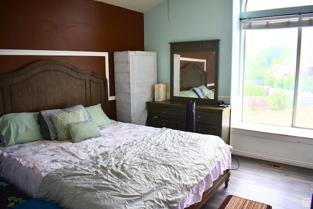 1037 W State Cir, Salt Lake City, UT 84104 - bedroom with lofted ceiling and wood finished floors