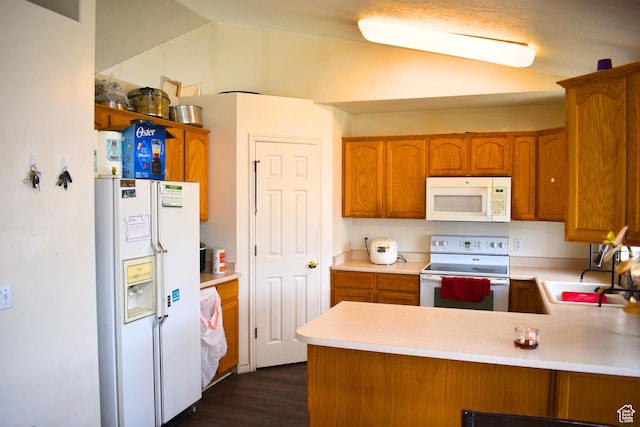 1037 W State Cir, Salt Lake City, UT 84104 - kitchen with white appliances, light countertops, a peninsula, and brown cabinets