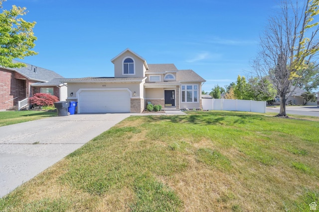 637 W Chase Ln, Centerville, UT 84014 - traditional-style house featuring stucco siding, driveway, and a garage