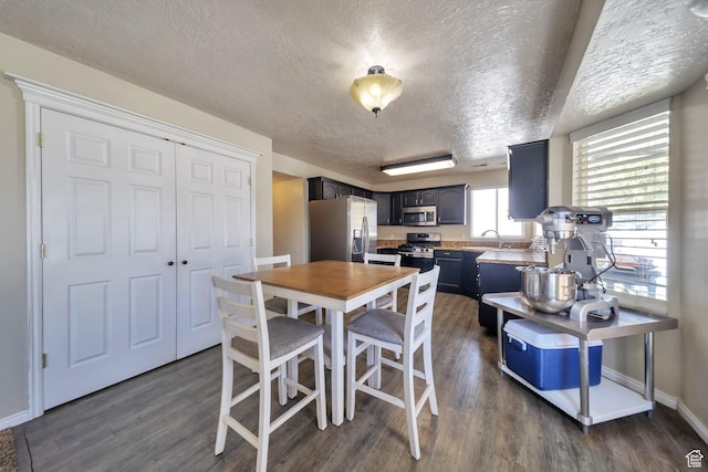 637 W Chase Ln, Centerville, UT 84014 - dining area with a textured ceiling and dark wood-type flooring
