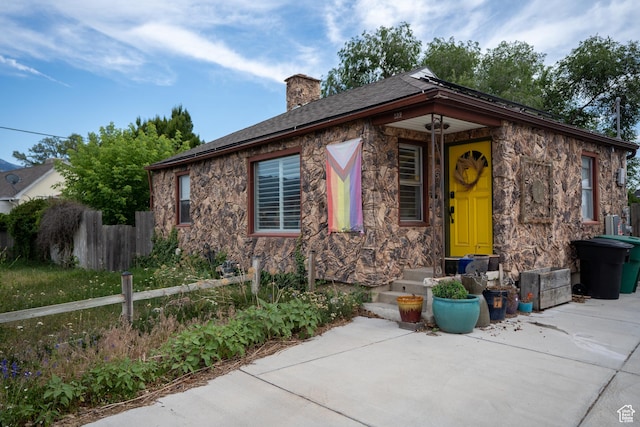 322 E Crawford Ave, Murray, UT 84107 - view of front facade with a chimney and stone siding