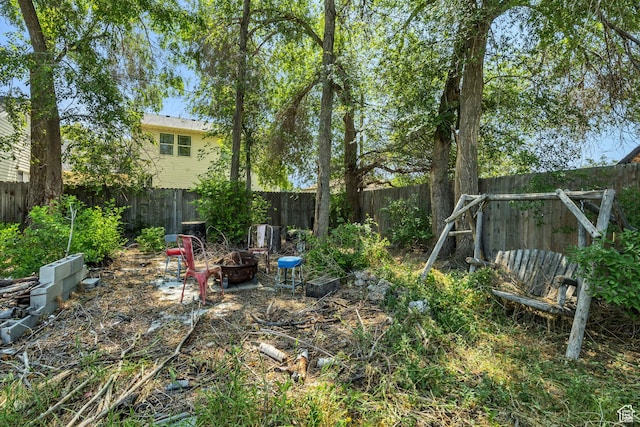 322 E Crawford Ave, Murray, UT 84107 - fenced backyard with a fire pit
