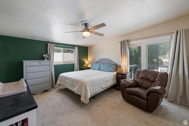 6764 S Enchanted Dr E, Midvale, UT 84047 - bedroom featuring light carpet, ceiling fan, a textured ceiling, and access to exterior