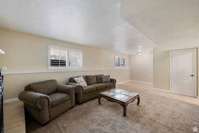 6764 S Enchanted Dr E, Midvale, UT 84047 - living room featuring a textured ceiling and baseboards