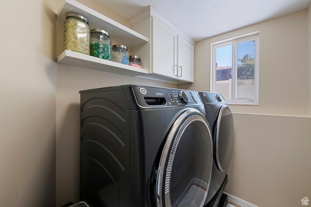 6764 S Enchanted Dr E, Midvale, UT 84047 - laundry area with independent washer and dryer, cabinet space, and a textured ceiling