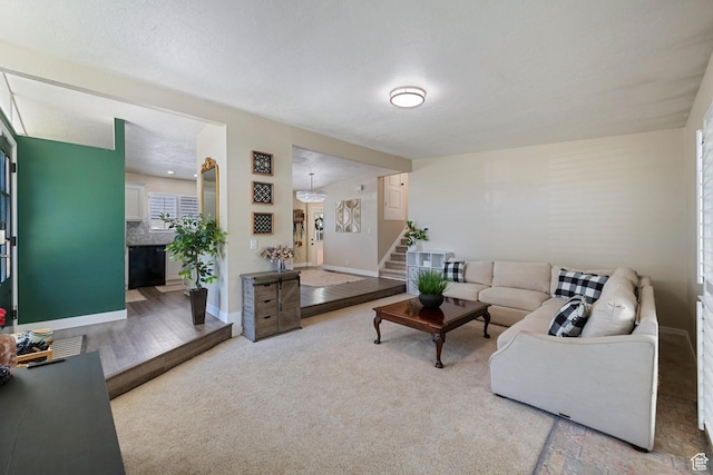 6764 S Enchanted Dr E, Midvale, UT 84047 - living area with stairway and carpet flooring