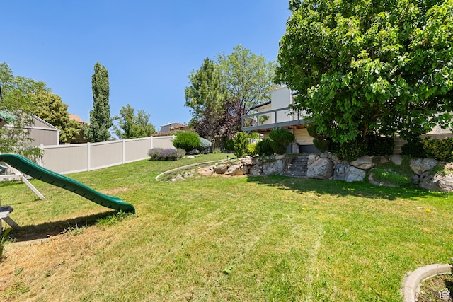 6764 S Enchanted Dr E, Midvale, UT 84047 - view of yard with a playground