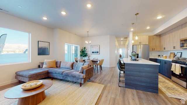 1378 S Sawmill Blvd Unit 7-703, Heber City, UT 84032 - living area featuring light wood finished floors, a chandelier, and recessed lighting