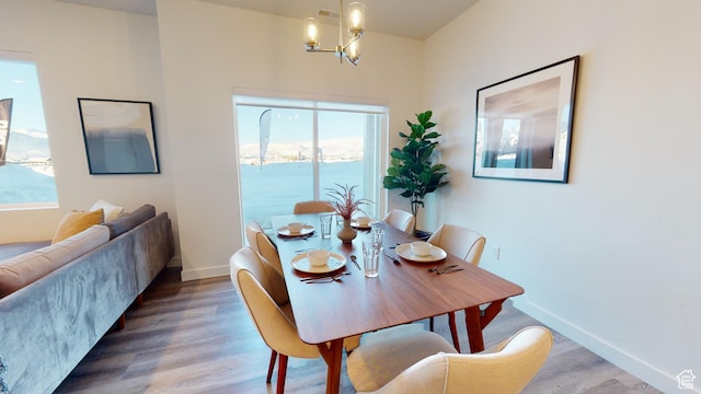 1378 S Sawmill Blvd Unit 7-703, Heber City, UT 84032 - dining room featuring wood finished floors and a chandelier