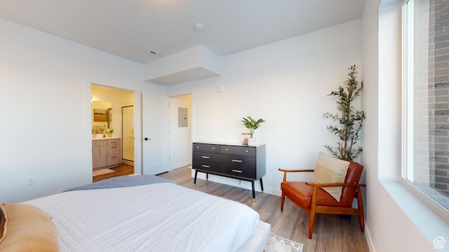 1378 S Sawmill Blvd Unit 7-703, Heber City, UT 84032 - bedroom with light wood-type flooring, electric panel, and ensuite bathroom