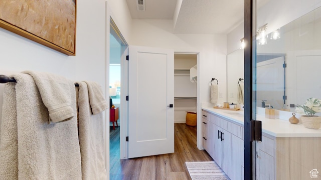 1378 S Sawmill Blvd Unit 7-703, Heber City, UT 84032 - full bathroom featuring wood finished floors, vanity, and a spacious closet