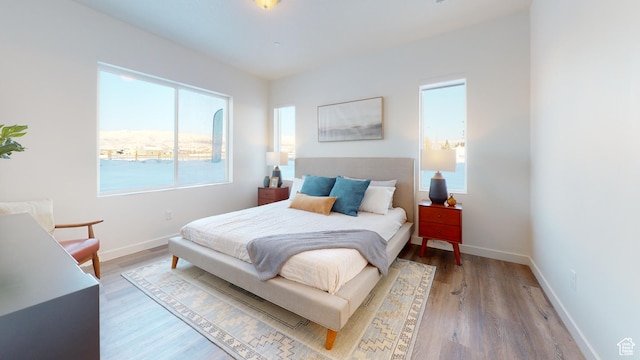 1378 S Sawmill Blvd Unit 7-703, Heber City, UT 84032 - bedroom with light wood-type flooring and baseboards