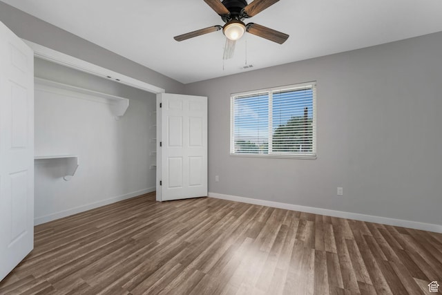 153 E Main St Unit B, Santaquin, UT 84655 - unfurnished bedroom featuring wood finished floors, a ceiling fan, and a closet